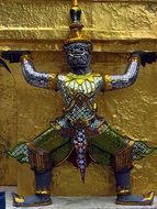 statue in gold in the temple