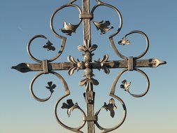 iron cross against the blue sky