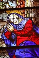 Virgin Mary on colorful stained glass in a church