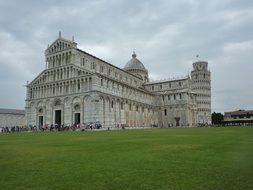 medieval Roman Catholic cathedral dedicated to the Assumption of the Virgin Mary at cloudy day, italy, pisa