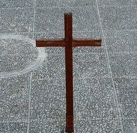 wooden cross at pavement