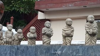 gray buddhist statues in a temple