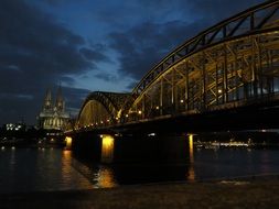 huge lighted bridge leading to the cathedral in germany