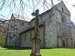 cross near a church in hungary