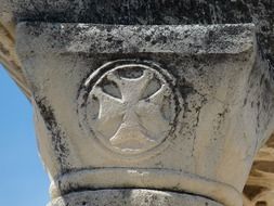 cross symbol on a pillar of the temple