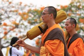 Buddhist monks in orange robes in the temple