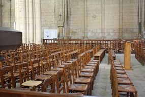 rows of wooden chairs in a church