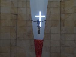 glowing cross on a crucifix on the wall