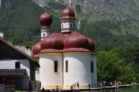 white stone Church with red domes