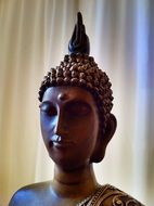 bust of a buddha in asia