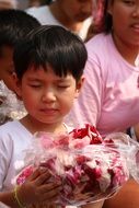 children at the ceremony with rose petals