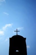 cross silhouette on the blue sky