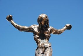 sculpture of christ against the blue sky