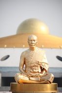 golden buddha monk statue