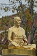 meditating monk statue