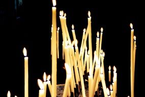 burning candles in church in the dark