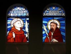 photos of the saints in the stained glass window