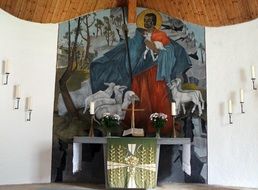 Good Shepherd painting behind altar in protestant church