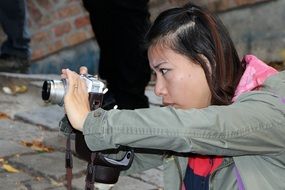 girl takes a photo in the temple