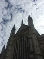 cathedral with spiers against a cloudy sky