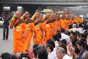 walking of buddhist monks to the temple