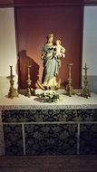 virgin maria with baby jesus, statue in altar, netherlands, amsterdam