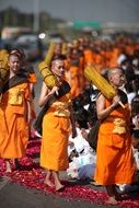 Buddhists in orange coats