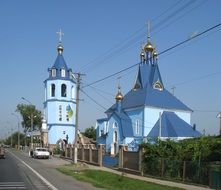 orthodox church with bell tower at road, ukraine