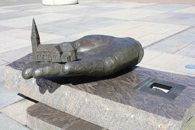 religon church on hand, modern bronze sculpture on square, denmark, Holstebro