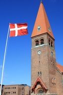 flag on the background of the church in Denmark