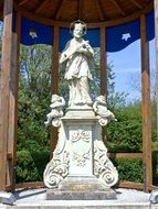 white sculpture of Johannes Nepomuk as a decoration of the park