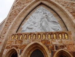 Virgin Mary on the mural at the entrance to the church