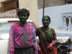 faces paint in the green after the festival in Thailand