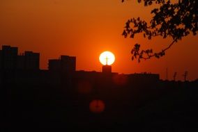 bright sun in the sunset on the background of the church