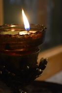 candle for prayer in a church