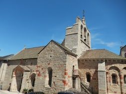 stone church with a bell in the village