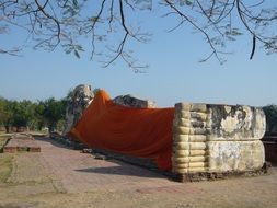 big stone reclining buddha statue in Thailand