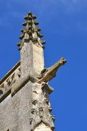 gargoyle figure on old church roof
