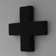 black cross on white wall
