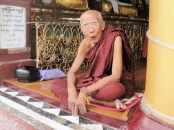 An elderly Buddhist monk in the temple