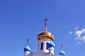 Cross on the church in summer