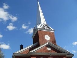 steeple of brick church at sky