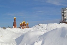 distant view of the temple behind the snow