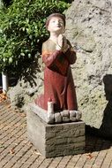 sculpture of a praying child