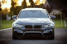 front of a brand-new BMW sports car