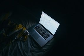 apple macbook on the bed