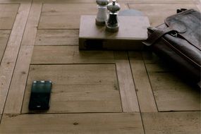 iphone is on a wood table
