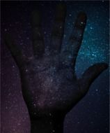 Hand against the background of the universe