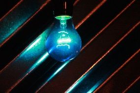 blue light bulb on a striped background