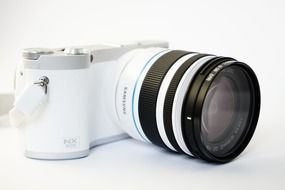 White camera with zoom lens